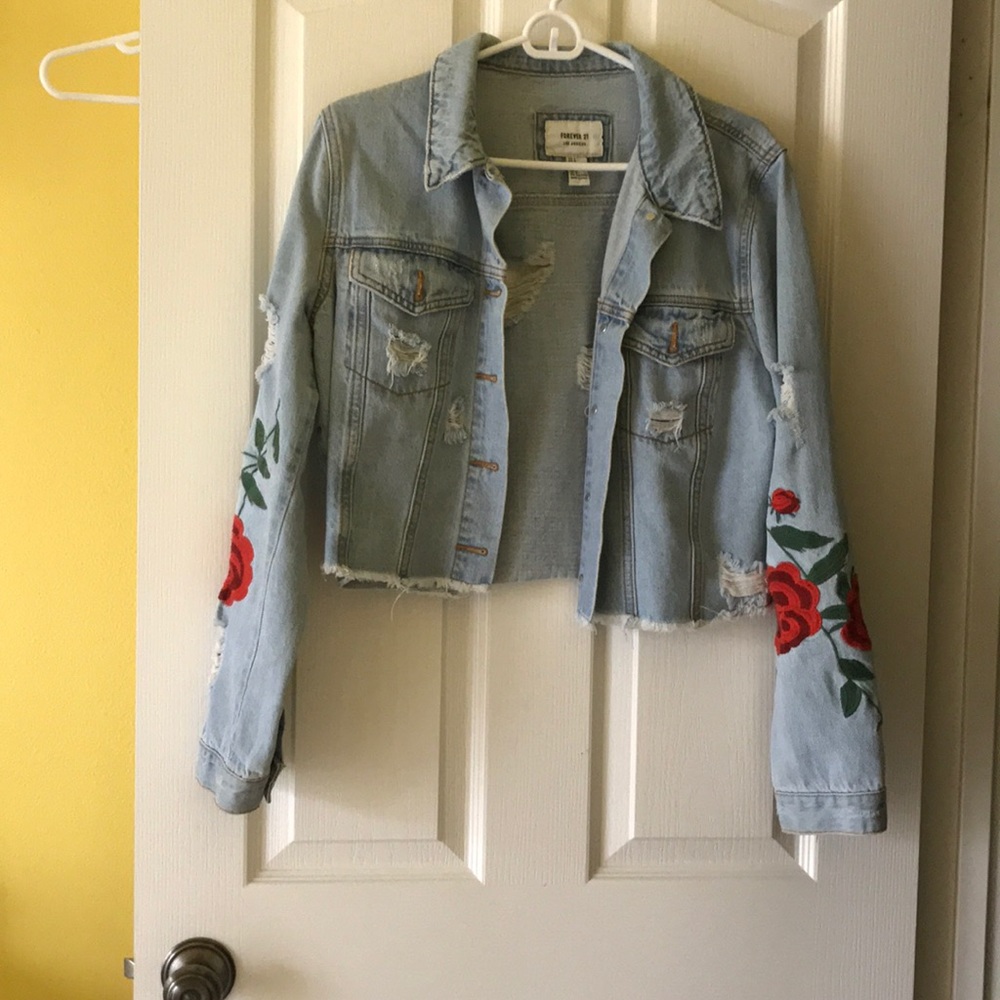 jean jacket w/ rips and flowers (roses)